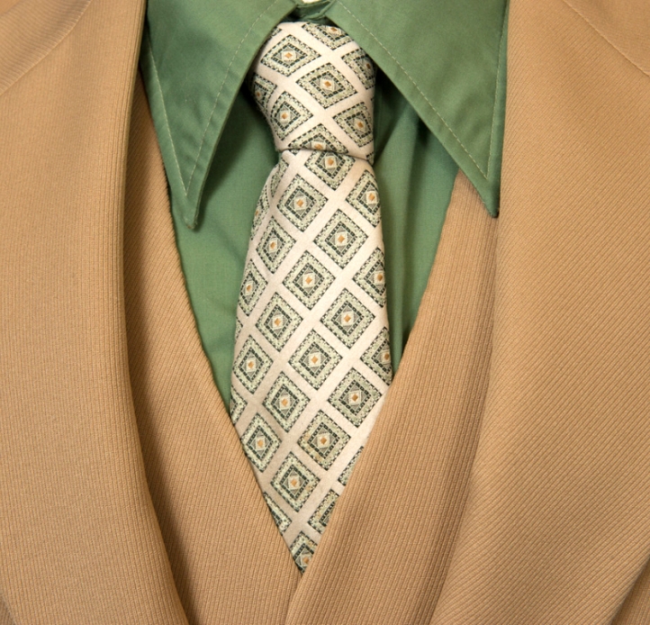 Tan suit with a green shirt 